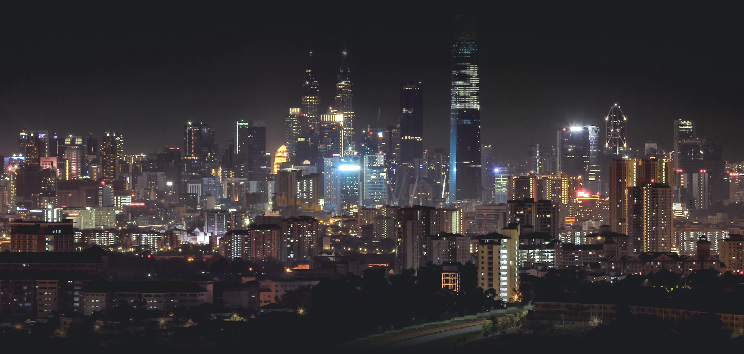 Kuala Lumpur skyline at night, with the Petronas Towers